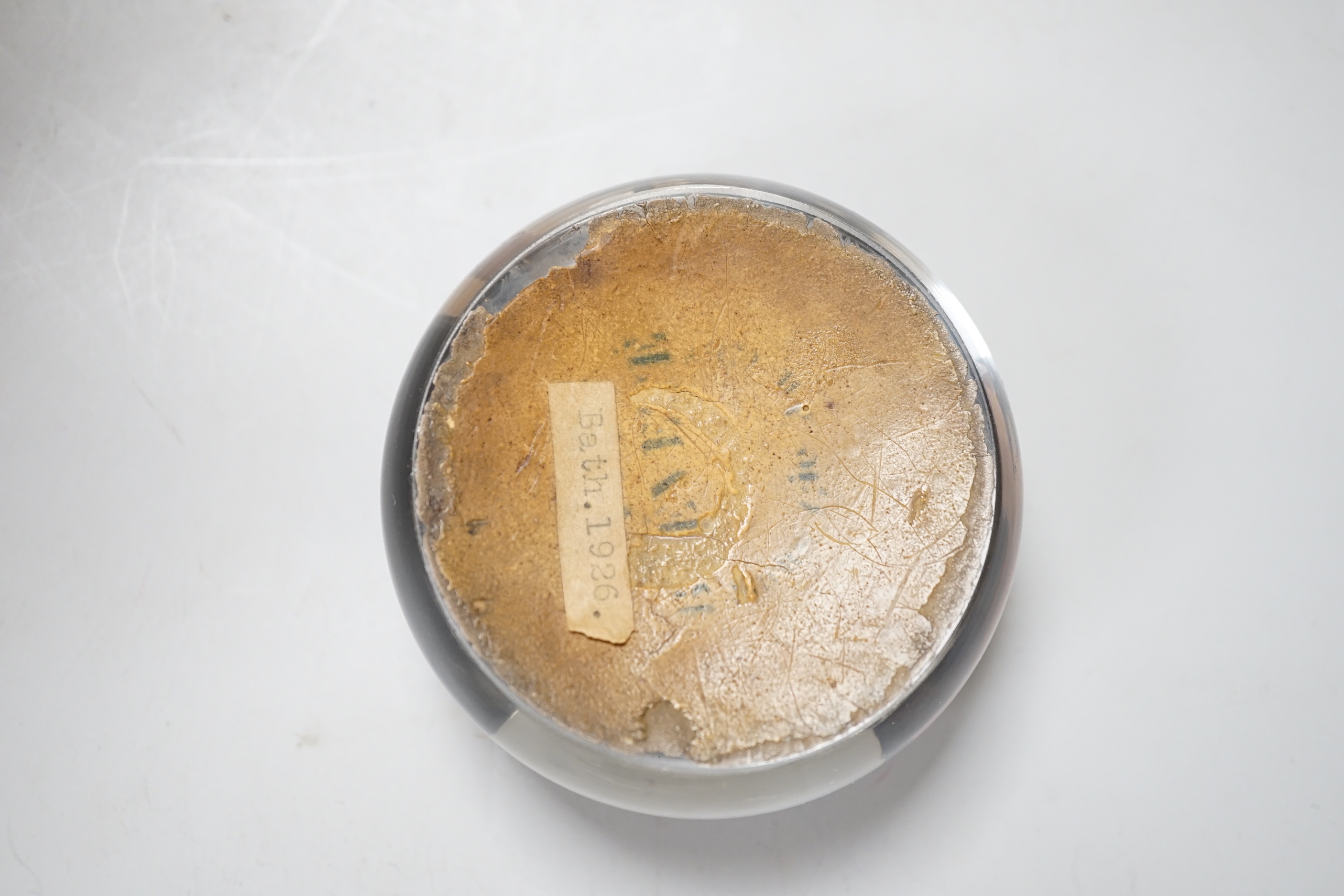 A Queen Victoria reverse decorated glass paperweight, approximately 7.5cm diameter